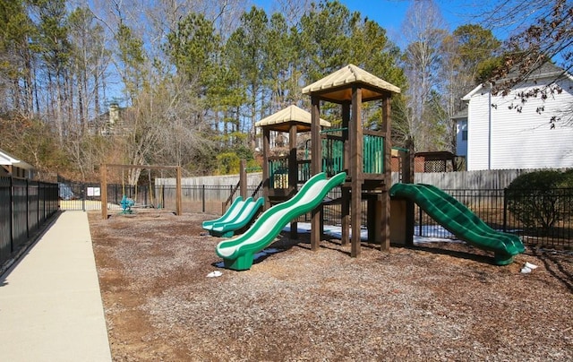 communal playground featuring fence