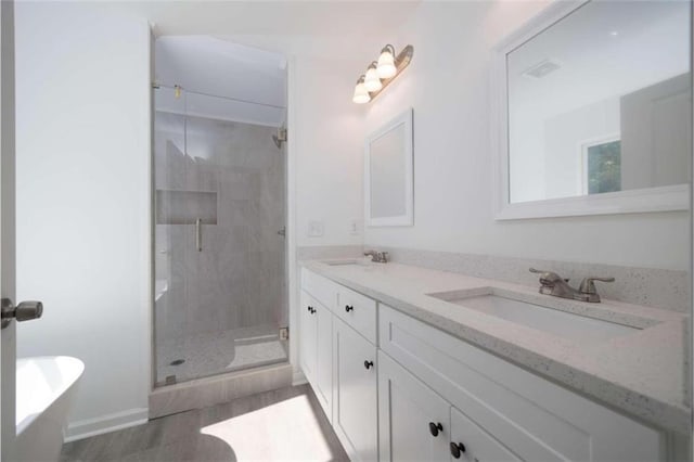 bathroom featuring vanity and separate shower and tub