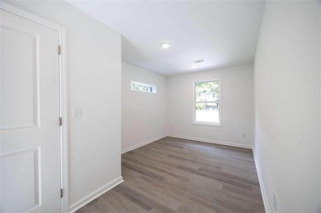 spare room with dark hardwood / wood-style flooring