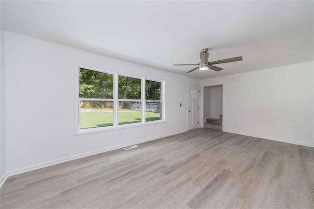 unfurnished room featuring light hardwood / wood-style flooring and ceiling fan