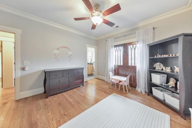 sitting room with ceiling fan, light hardwood / wood-style floors, and crown molding