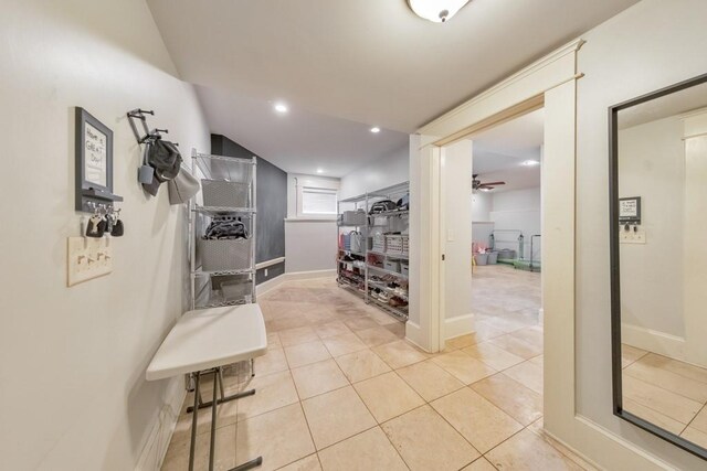 hall featuring light tile patterned floors