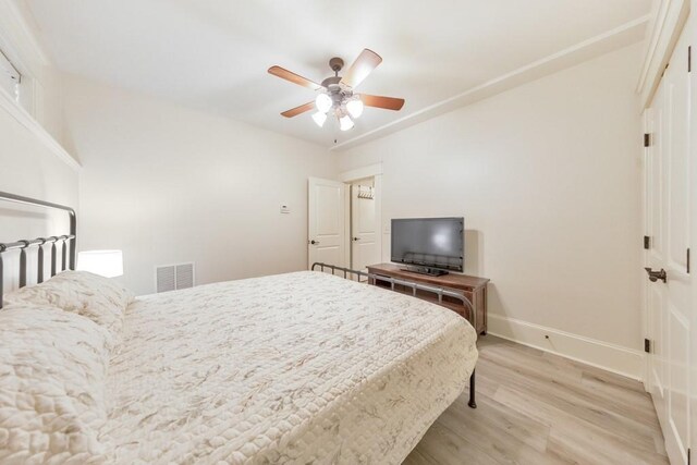 bedroom featuring ceiling fan and hardwood / wood-style flooring