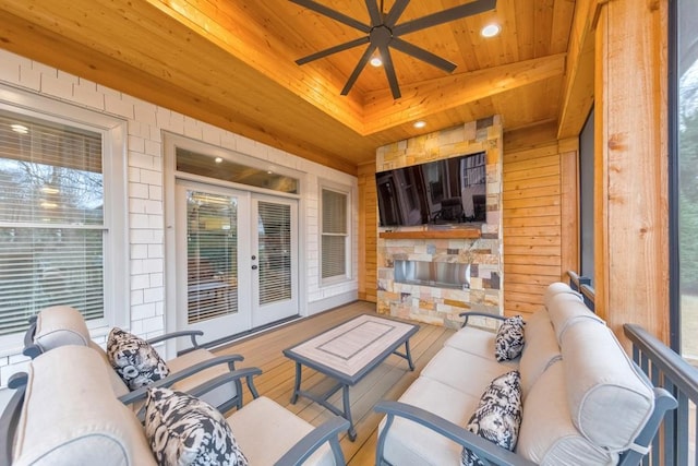 view of patio / terrace with an outdoor living space, french doors, and ceiling fan