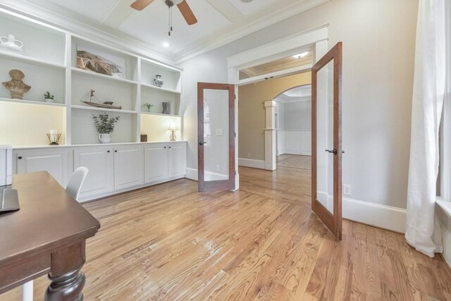 office with french doors, light hardwood / wood-style floors, ceiling fan, and ornamental molding