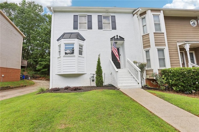 208 Hembree Park Ter, Roswell, GA 30076 - view of front of property featuring brick siding and a front lawn
