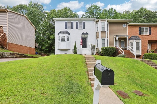 208 Hembree Park Ter, Roswell, GA 30076 - view of front of house with a front yard