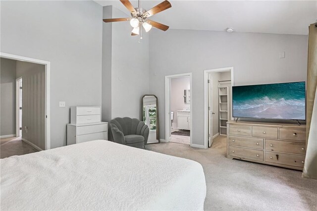 208 Hembree Park Ter, Roswell, GA 30076 - bedroom with high vaulted ceiling, light carpet, ensuite bathroom, a ceiling fan, and a spacious closet
