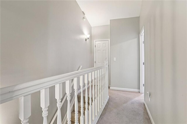 208 Hembree Park Ter, Roswell, GA 30076 - corridor with light colored carpet, vaulted ceiling, and an upstairs landing