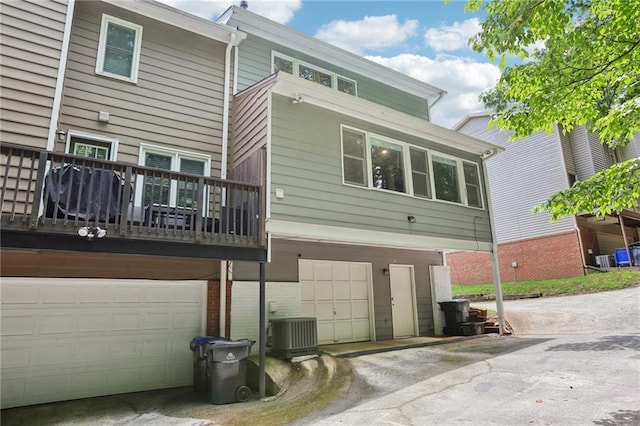 208 Hembree Park Ter, Roswell, GA 30076 - back of property featuring a garage and brick siding