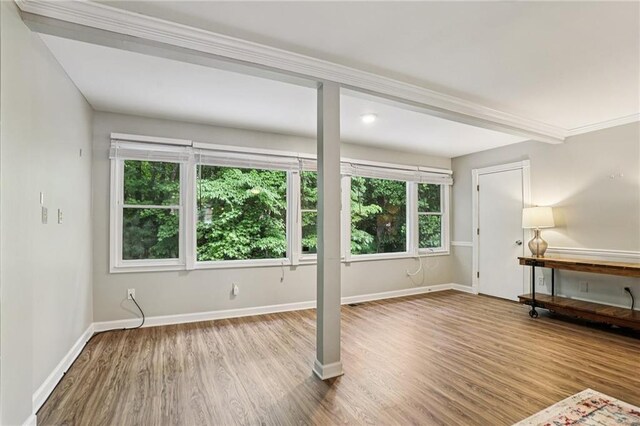 208 Hembree Park Ter, Roswell, GA 30076 - unfurnished living room featuring wood finished floors and baseboards