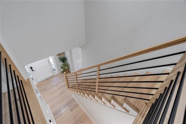 staircase featuring hardwood / wood-style flooring