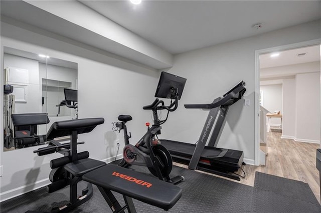 workout area with light wood-type flooring