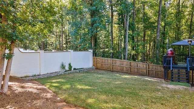 view of yard with a wooden deck