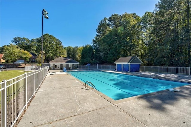 view of swimming pool featuring an outdoor structure