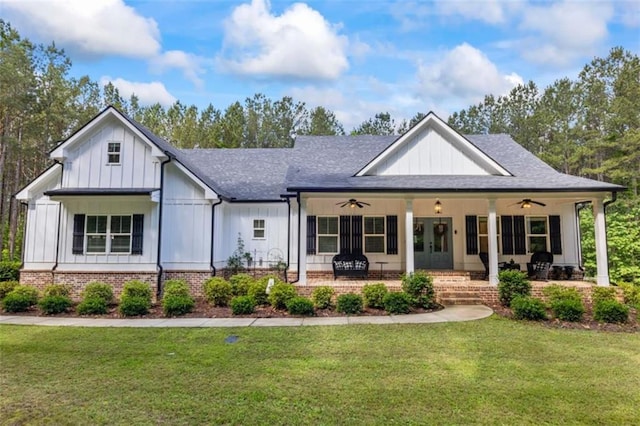726 Swilling Rd, Eastanollee, GA 30538 - modern farmhouse style home with a ceiling fan, a front lawn, board and batten siding, and covered porch