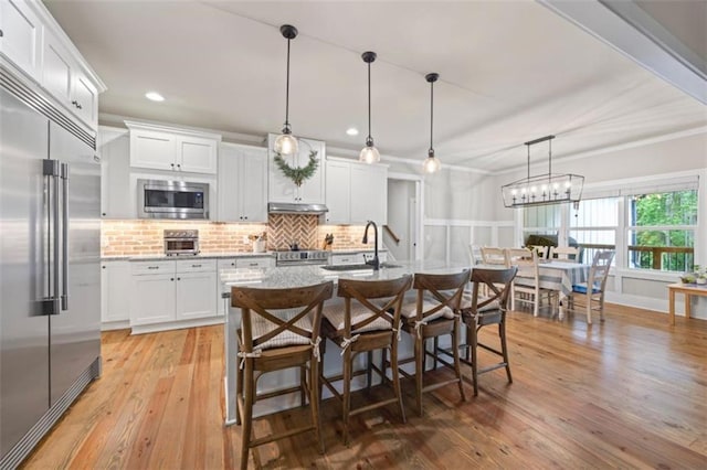 726 Swilling Rd, Eastanollee, GA 30538 - kitchen with built in appliances, a sink, ornamental molding, white cabinetry, and light wood-style flooring