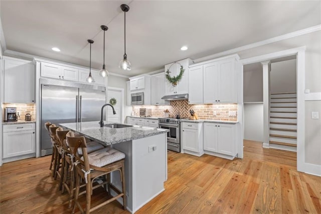 726 Swilling Rd, Eastanollee, GA 30538 - kitchen featuring built in appliances, a sink, ornamental molding, decorative backsplash, and under cabinet range hood