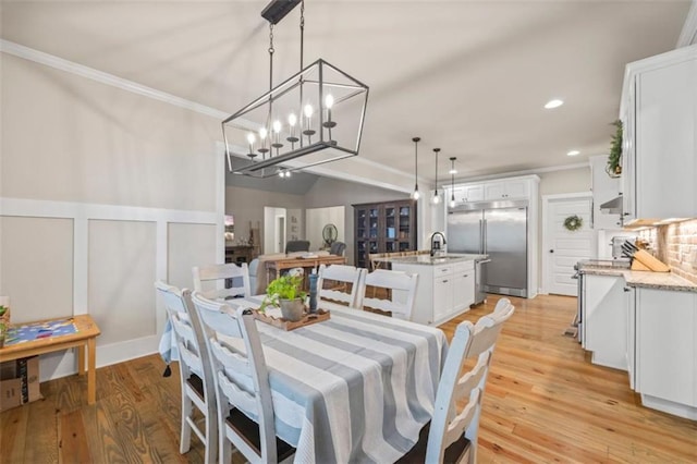 726 Swilling Rd, Eastanollee, GA 30538 - dining area with ornamental molding, light wood finished floors, a chandelier, and recessed lighting