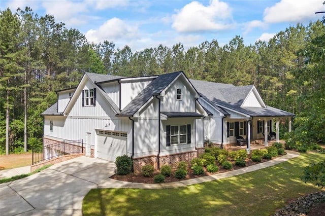 726 Swilling Rd, Eastanollee, GA 30538 - view of front facade featuring concrete driveway, brick siding, a porch, and an attached garage