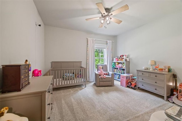 726 Swilling Rd, Eastanollee, GA 30538 - bedroom with light colored carpet, a crib, and a ceiling fan