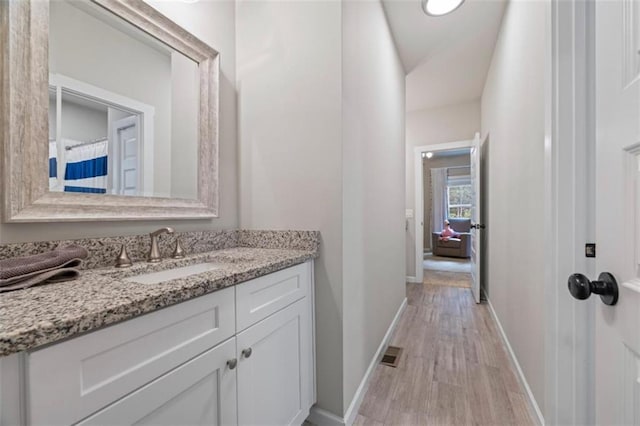 726 Swilling Rd, Eastanollee, GA 30538 - full bathroom with baseboards, wood finished floors, and vanity
