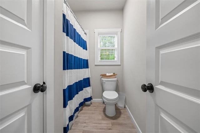 726 Swilling Rd, Eastanollee, GA 30538 - full bathroom with toilet, wood finished floors, baseboards, and curtained shower