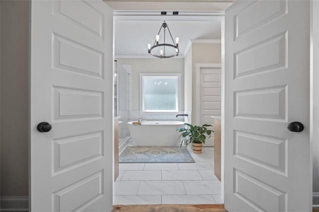 726 Swilling Rd, Eastanollee, GA 30538 - full bathroom featuring a chandelier, a freestanding bath, and ornamental molding