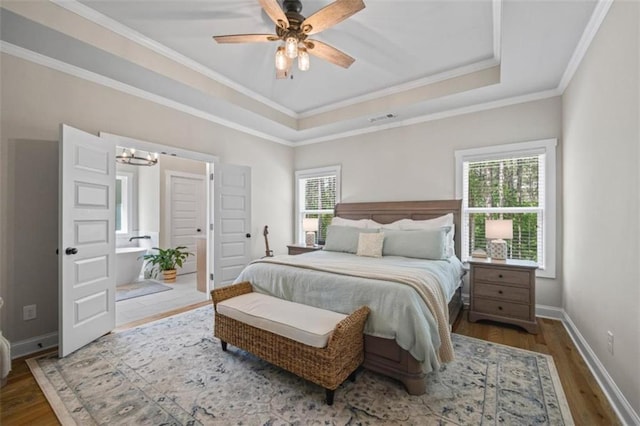 726 Swilling Rd, Eastanollee, GA 30538 - bedroom featuring wood finished floors, crown molding, a chandelier, baseboards, and a raised ceiling