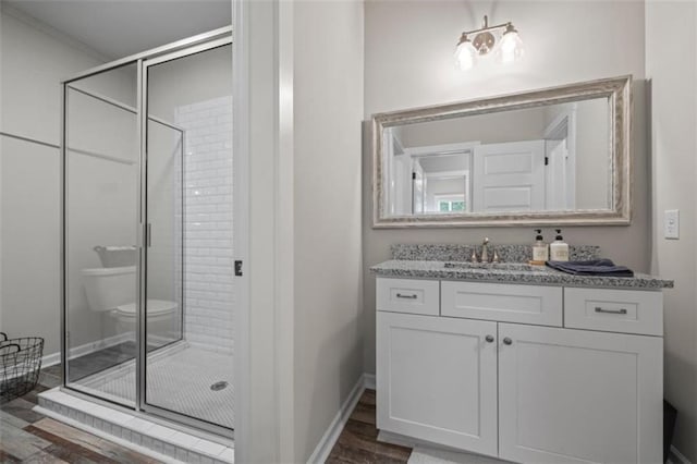 726 Swilling Rd, Eastanollee, GA 30538 - full bathroom with a stall shower, vanity, toilet, and baseboards