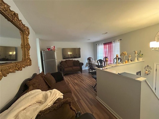 living room with dark hardwood / wood-style floors