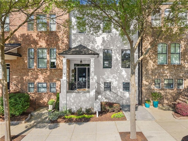 3932 Boston Common St, Suwanee, GA 30024 - townhome / multi-family property with stairs and brick siding