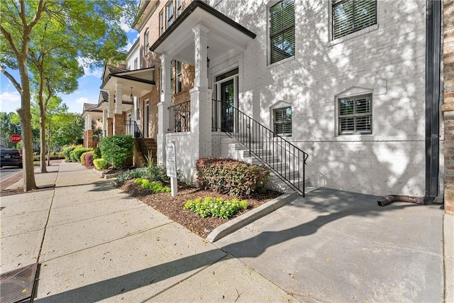 3932 Boston Common St, Suwanee, GA 30024 - view of property exterior with brick siding and stairs