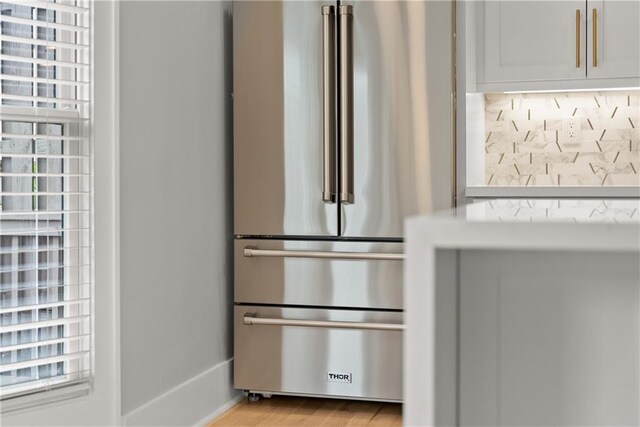 3932 Boston Common St, Suwanee, GA 30024 - kitchen view of high end fridge and light wood-style floors