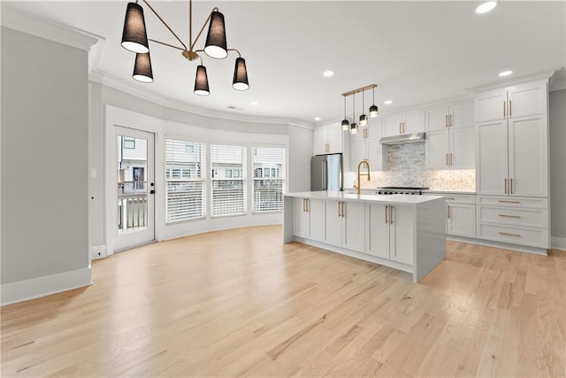 3932 Boston Common St, Suwanee, GA 30024 - kitchen featuring high end fridge, crown molding, tasteful backsplash, light wood-type flooring, and a chandelier
