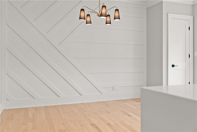 3932 Boston Common St, Suwanee, GA 30024 - detailed view of wood finished floors and a chandelier