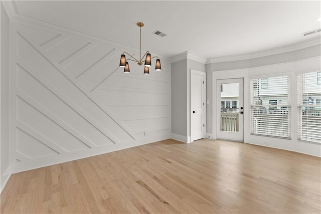 3932 Boston Common St, Suwanee, GA 30024 - unfurnished dining area with a chandelier, ornamental molding, light wood-style flooring, and baseboards