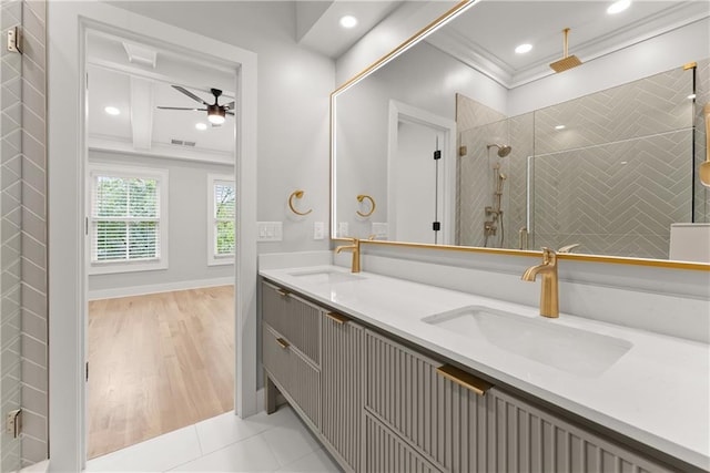 3932 Boston Common St, Suwanee, GA 30024 - bathroom featuring crown molding, ceiling fan, double vanity, a tile shower, and recessed lighting