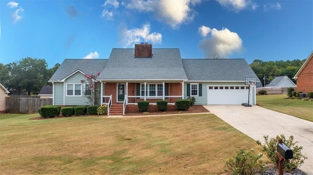 view of front facade with covered porch, concrete driveway, an attached garage, fence, and a front lawn