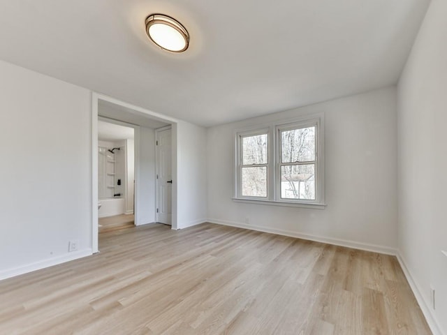 spare room with light wood-type flooring