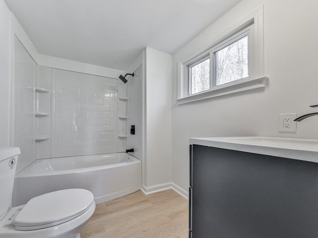 full bathroom with vanity, hardwood / wood-style flooring, toilet, and washtub / shower combination