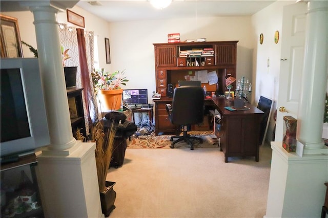 carpeted home office with ornate columns