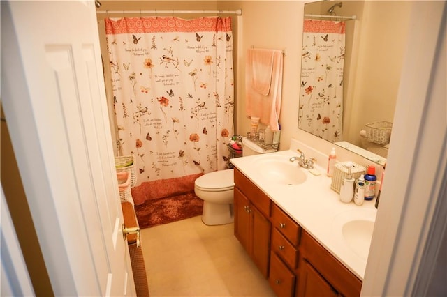 bathroom with vanity, toilet, and walk in shower