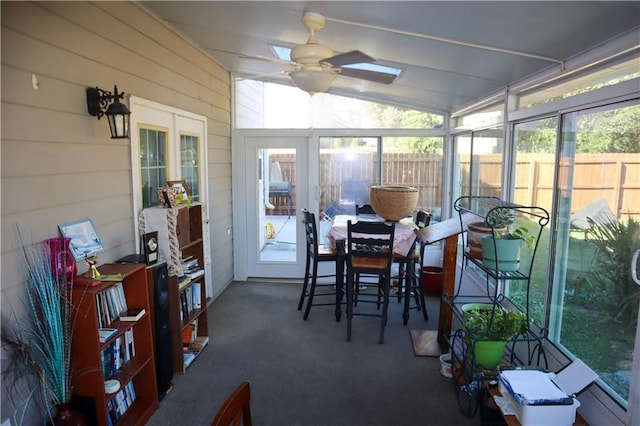 sunroom / solarium with vaulted ceiling and ceiling fan