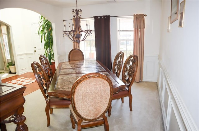 dining space featuring an inviting chandelier