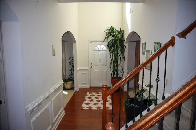 entryway with dark hardwood / wood-style flooring