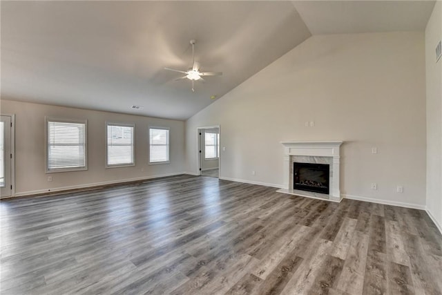 unfurnished living room featuring hardwood / wood-style flooring, high vaulted ceiling, a fireplace, and ceiling fan