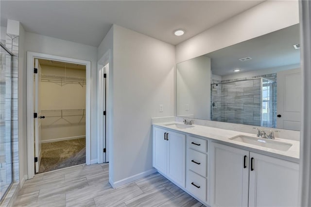 bathroom with vanity and an enclosed shower