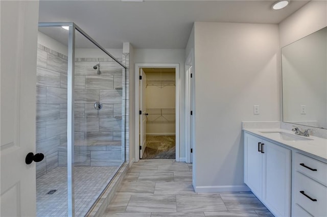 bathroom with vanity and walk in shower