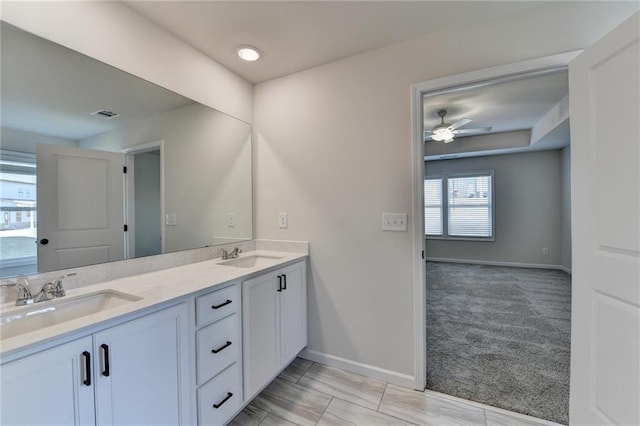 bathroom with ceiling fan and vanity